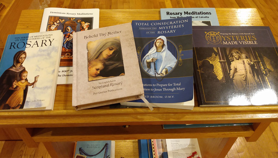 Photos of many favorite rosary meditation booklets.